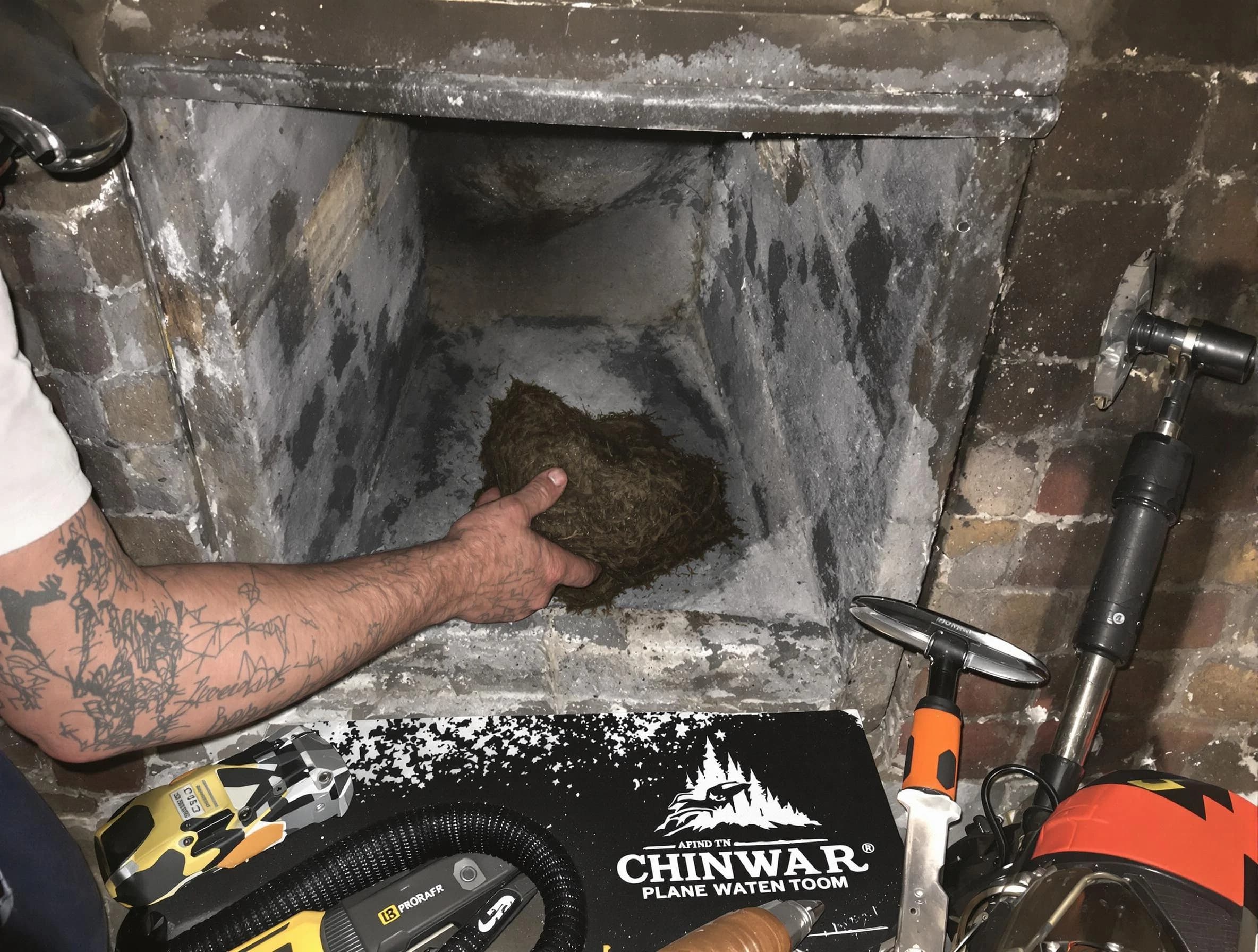 Clinton Chimney Sweep safely removing debris and screening chimney in Clinton, UT