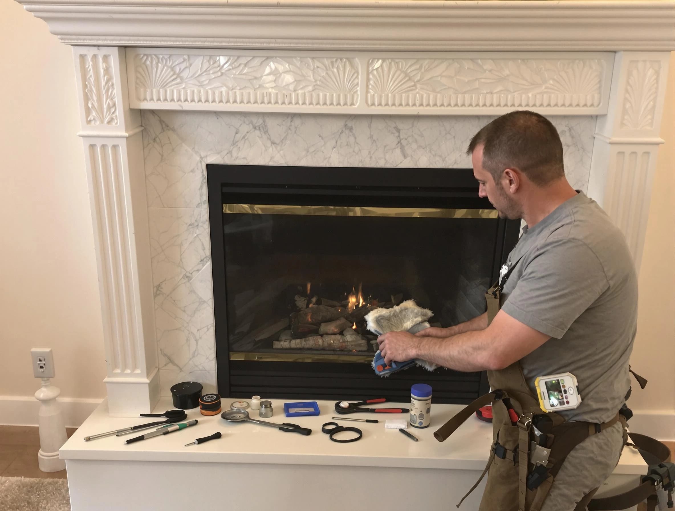 Clinton Chimney Sweep performing fireplace maintenance in Clinton, UT